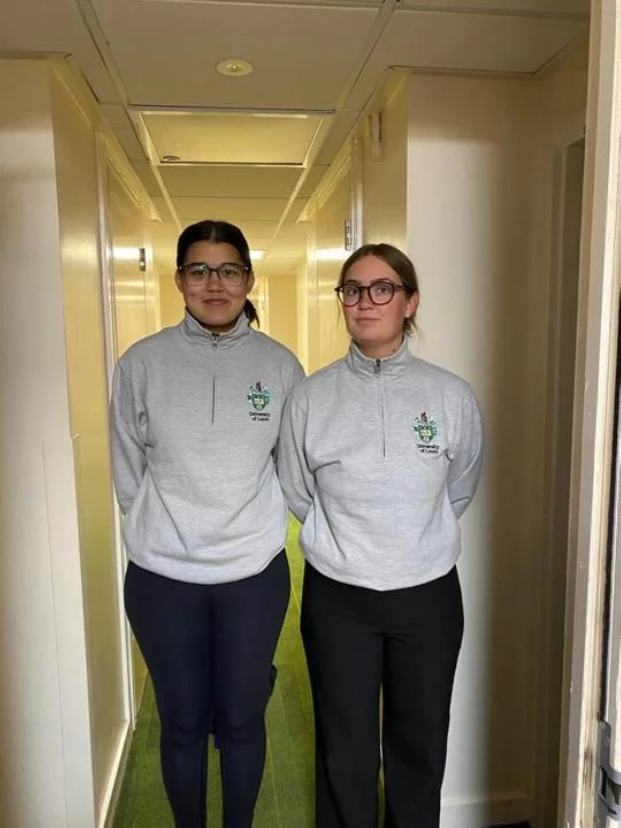 Danielle Paul (left) and her "bathroomie" Laura Snor (right)
from Denmark wearing matching sweater from Leeds
University while at Leeds International Summer School, July
2023